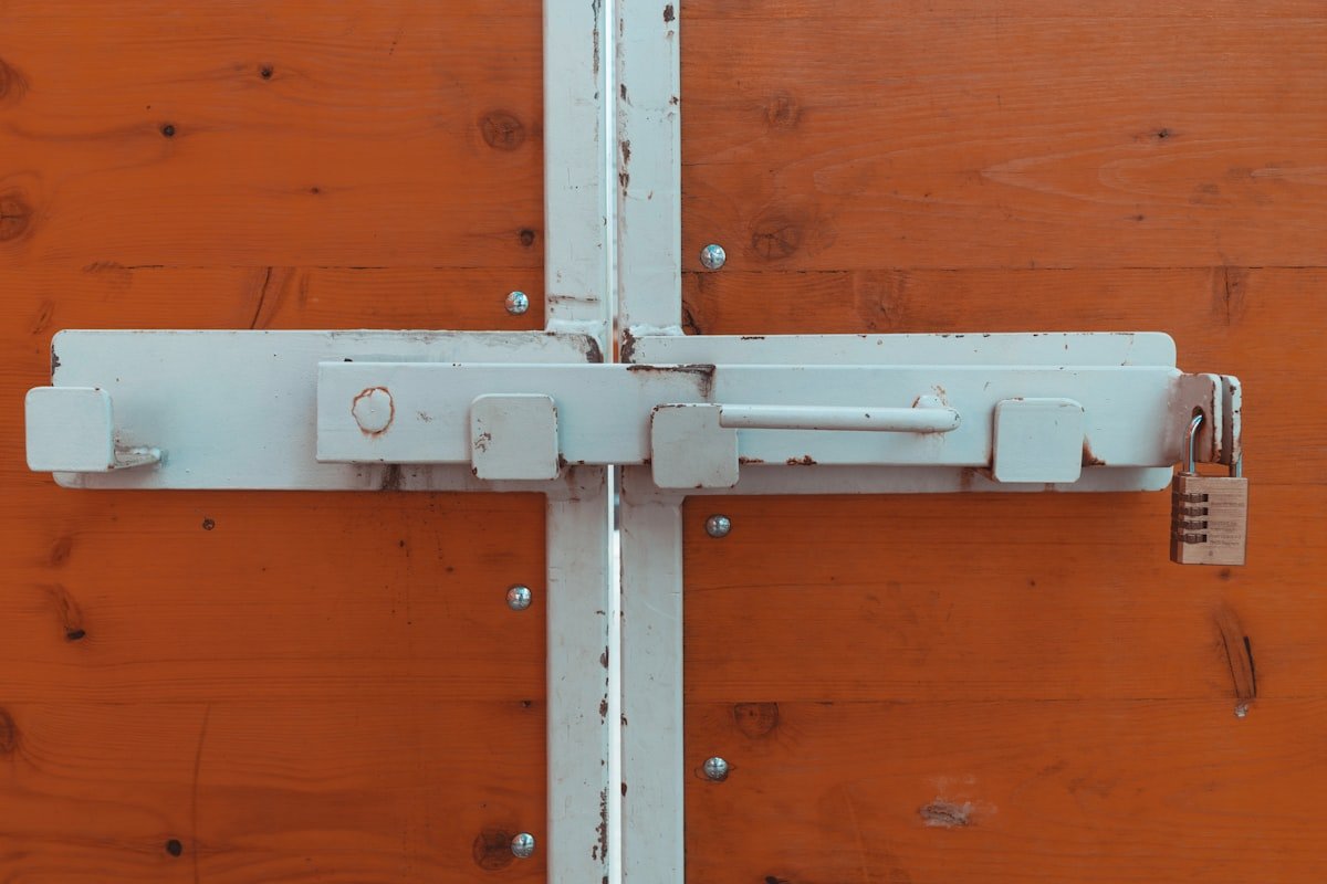 Sliding bolt latch secured with a padlock